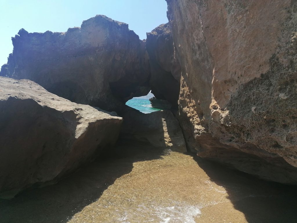 Rock formations and shallow water at Barlas Beach