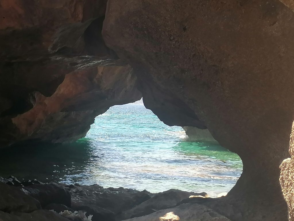 Rock opening at Barlas Beach overlooking the sea