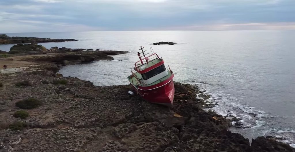 Aerial view of the Barlas shipwreck on the rocky coast