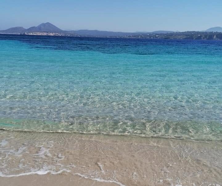Beach on Sapienza island with Methoni in the distance