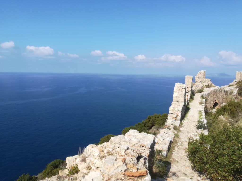 Stone walls of Palaiokastro Castle overlooking the sea.