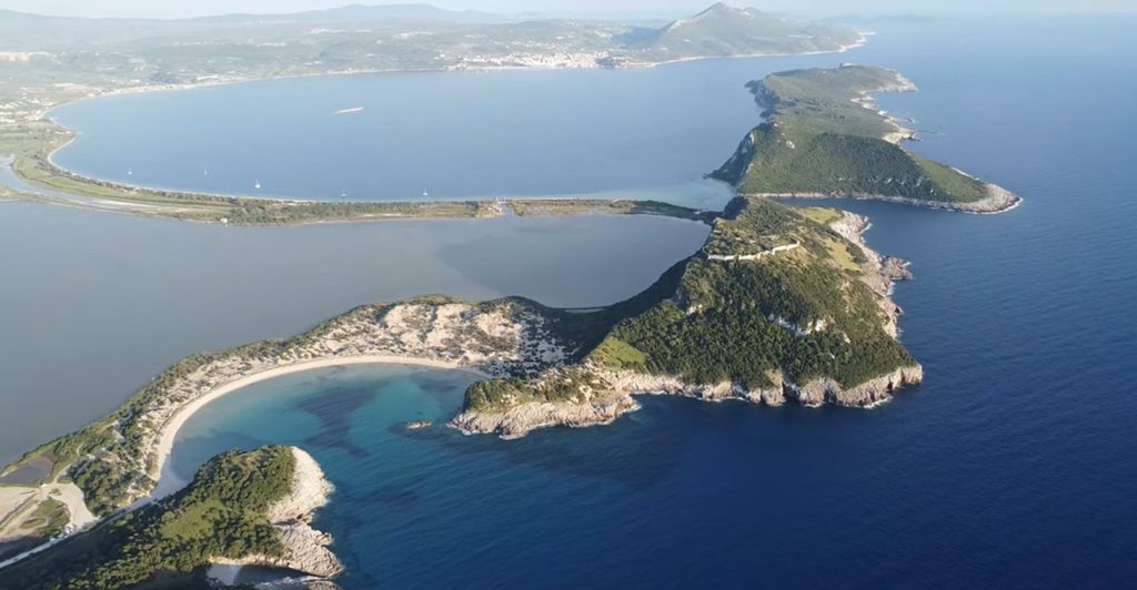 Drone view of Voidokilia Beach and Gialova Lagoon, showing the surrounding coastal landscape